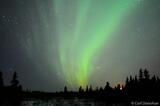 Photo of Aurora borealis and waxing crescent moon