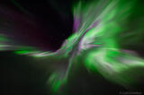 Incredible purple and green Aurora borealis corona photo