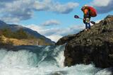 Whitewater kayaker scouting, Baker River, Patagonia, Chile