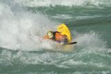 Whitewater kayaker, surfing in a wave, Baker River, Patagonia