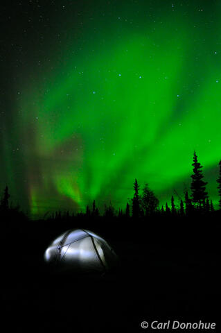 Northern lights over camping tent