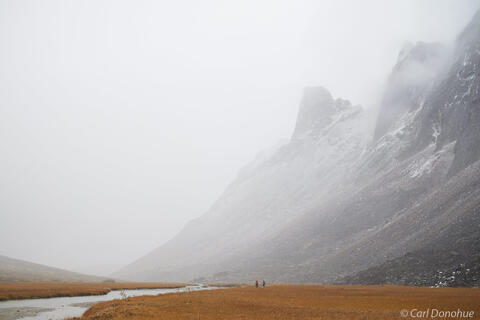 Backpackers hiking in thick fog Arctic Alaska