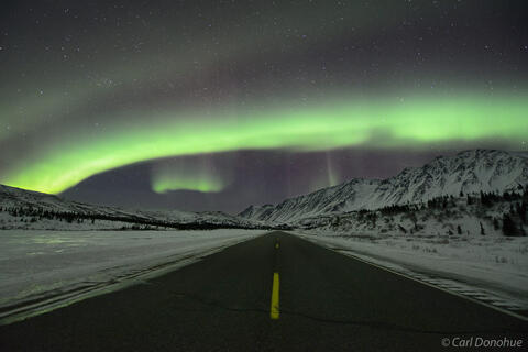 An Alaska Highway, Northern lights, and the Alaska Range photo