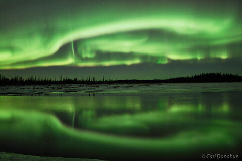 Aurora borealis and mirror reflection photo