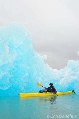 Sea kayaker and icebergs photo