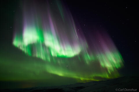 Bright northern lights and dark skies photo