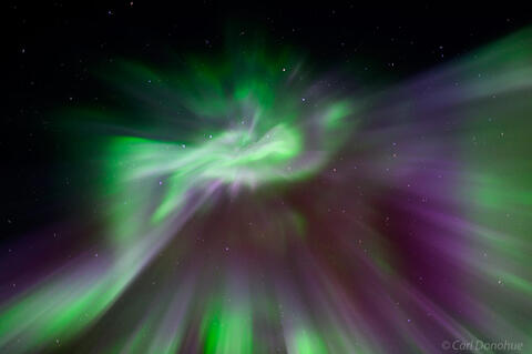 Purple and green Aurora borealis corona photo