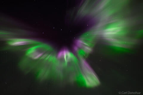 Purple and green auroral corona
