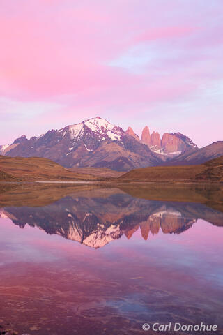 Dawn rises over the peaks of the Cordillera Paine, Torres del Paine National Park, Patagonia, Chile.