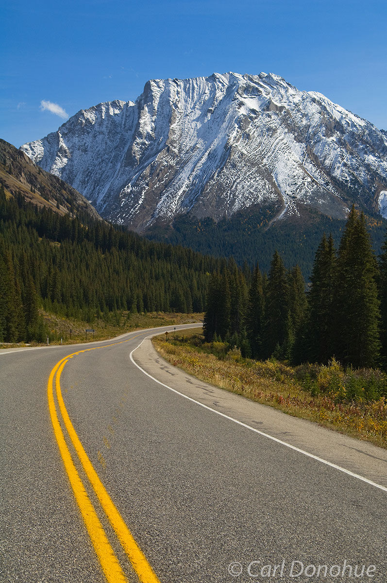 The winding road up towards highwood Pass and the continental divide in Alberta's Kananaskis Country. Fresh snow from an early...