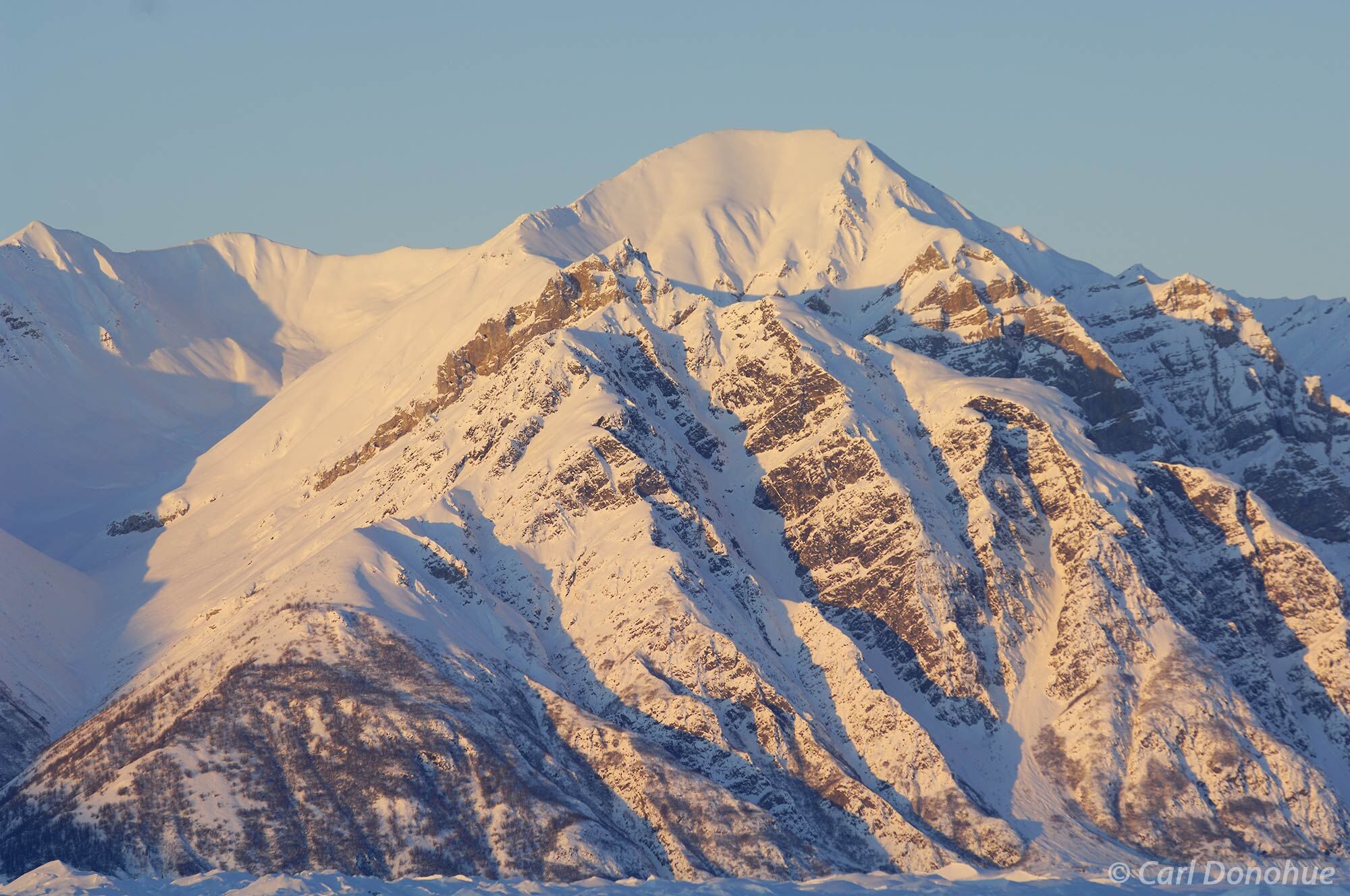 Wrangell Mountains in the early morning light, winter time, Wrangell-St. Elias National Park and Preserve, Alaska.  Looking across...