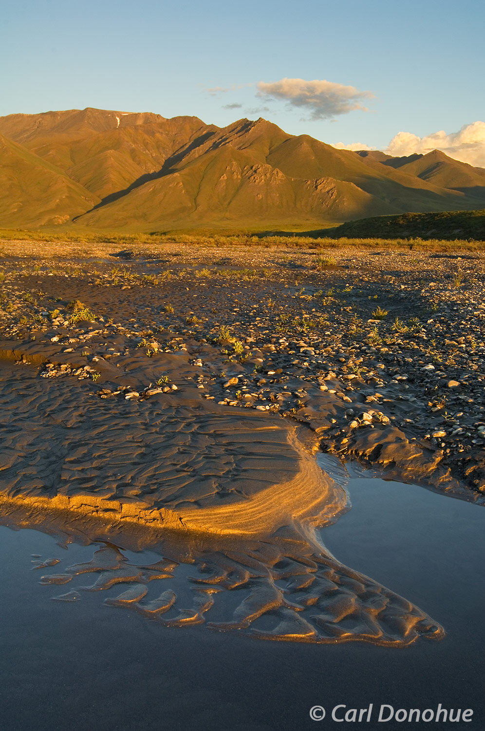 Late late on a long summer day in the arctic lasts literally all night long! Brooks mountain range and Canning River,  Arctic...