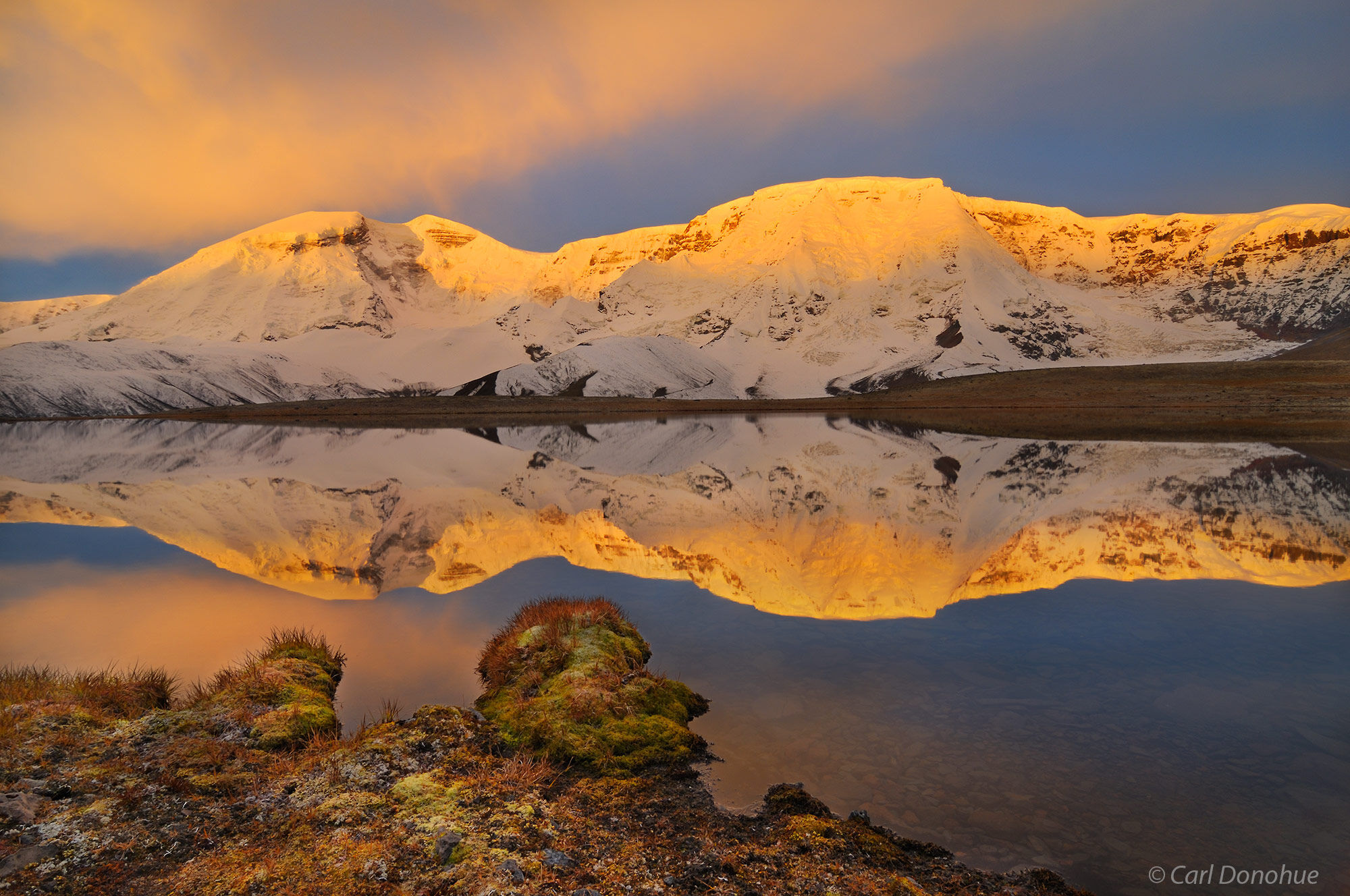 Sunrise lights up the eastern face of Mount Jarvis, in Alaska's Wrangell - St. Elias National Park and Preserve. Mount Jarvis...