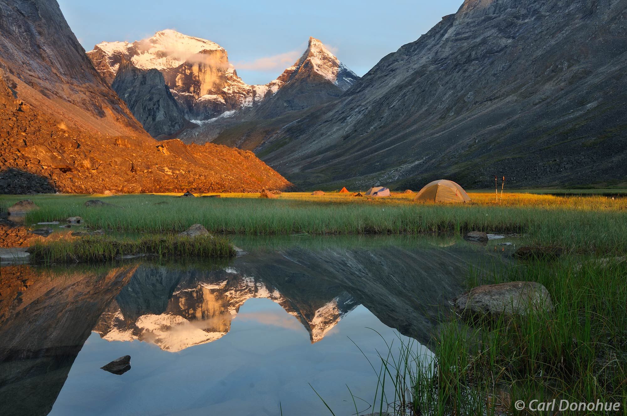 Early morning light on a calm still morning and the Arrigetch Peaks in Alaska’s Gates of the Arctic National Park are out in...