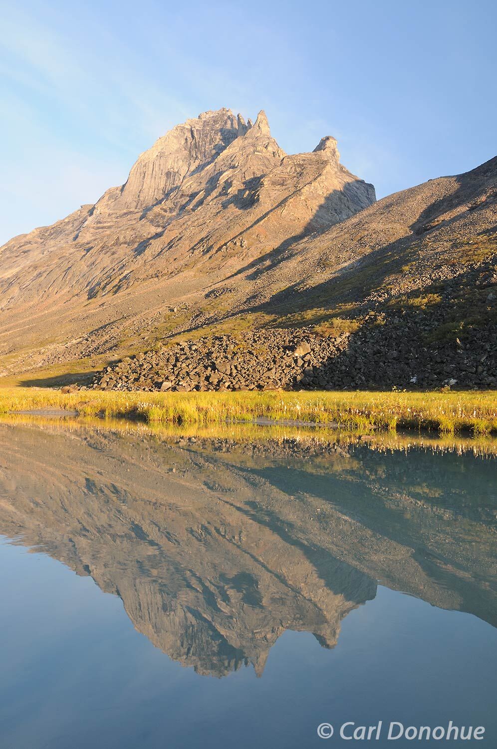 Early morning light on Caliban, of the famous Arrigetch Peaks, in Alaska’s Brooks Mountains. Gates of the Arctic National Park...