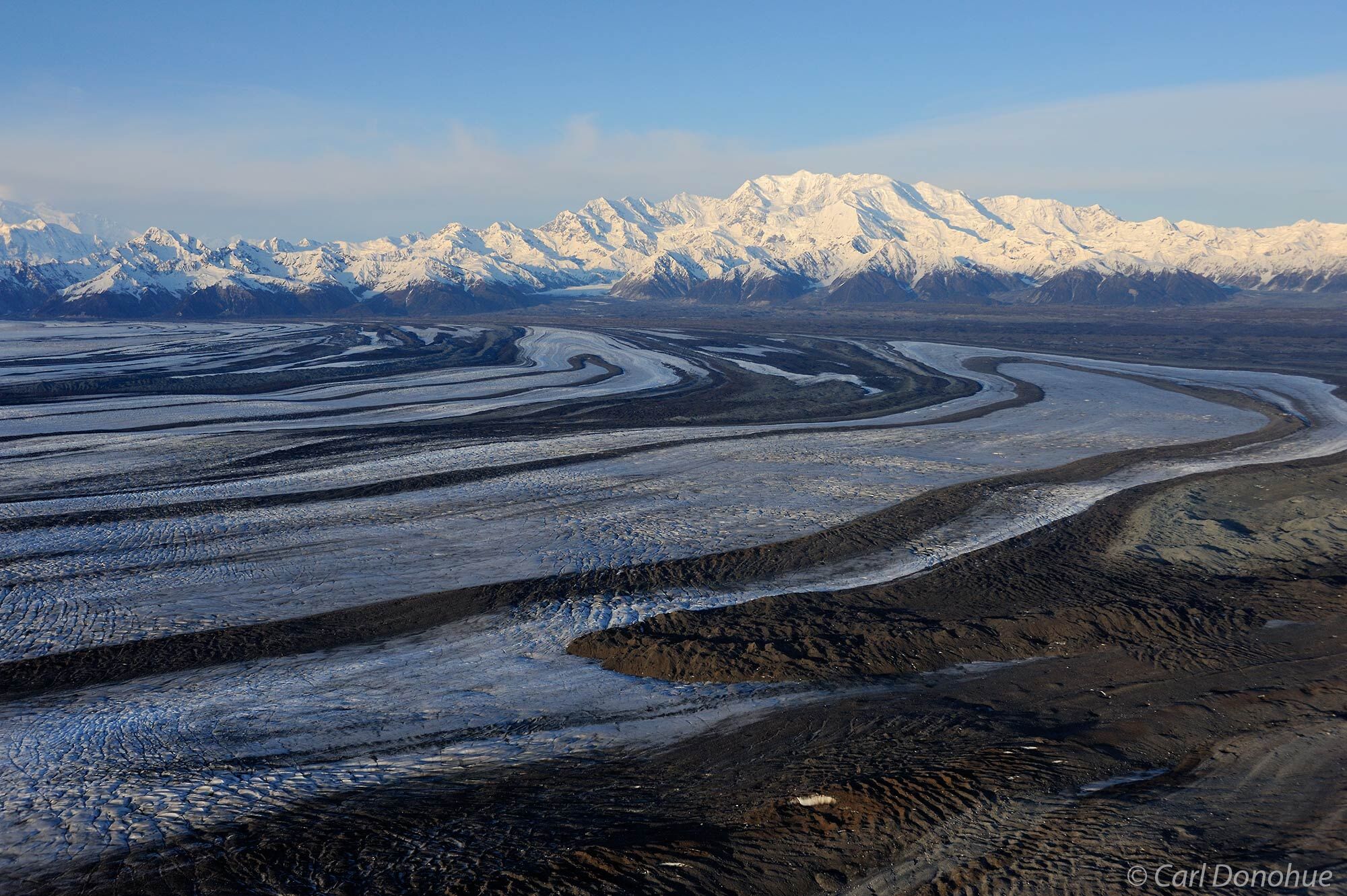 Mount Cook stands above the nearby Malaspina Glacier of Wrangell-St. Elias  National Park and Preserve, Alaska. Aerial photo...