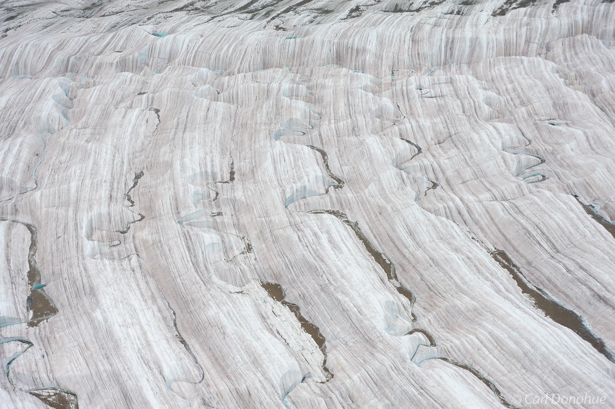 Glacial streams, moraine and patterns on the ice of Root Glacier, Wrangell-St. Elias National Park and Preserve, Alaska. (aerial...