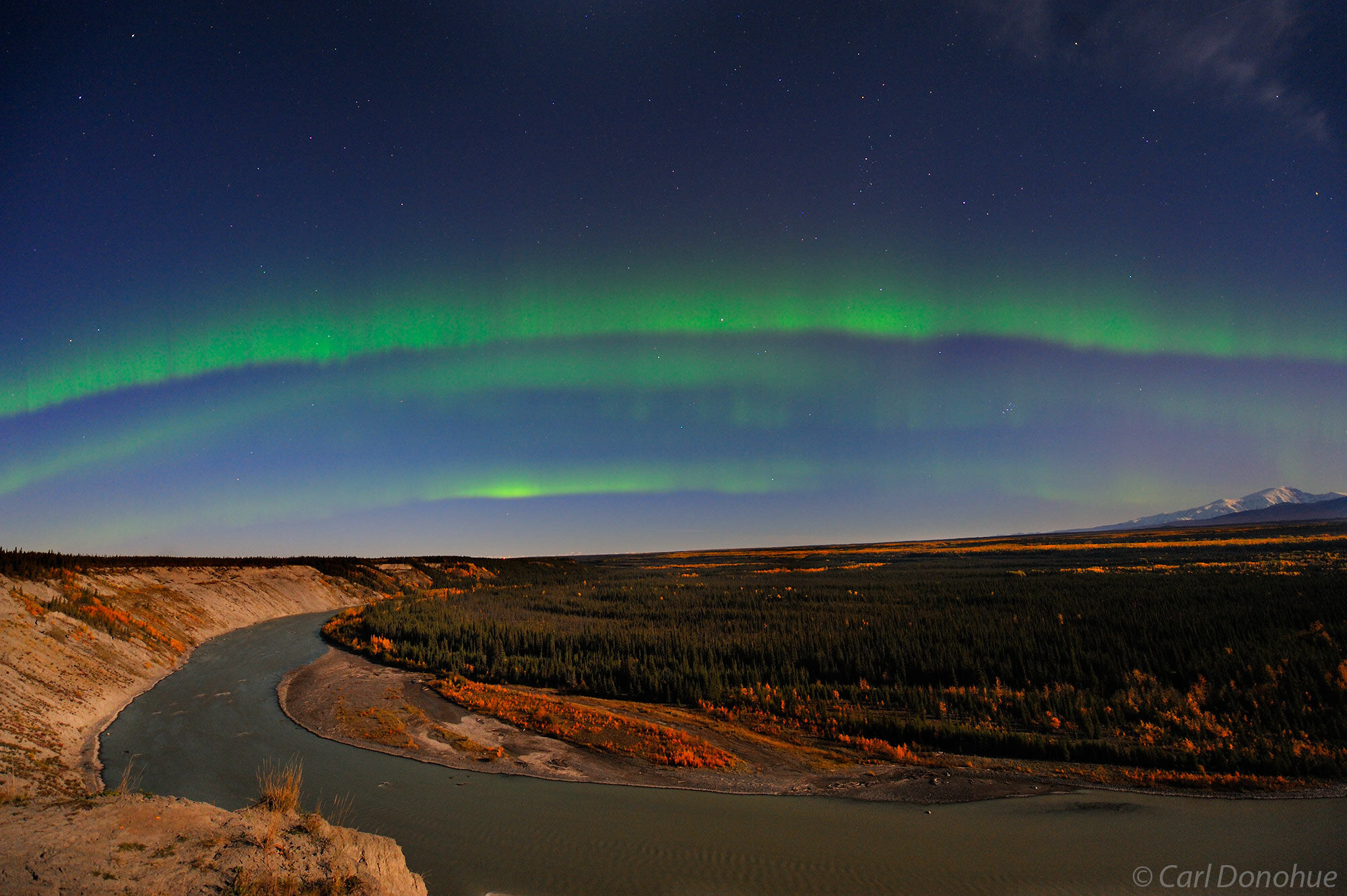 A bright green band of northern lights rise over the Copper River, taken from Simpson Hill, near Glennallen. Viewing Wrangell...