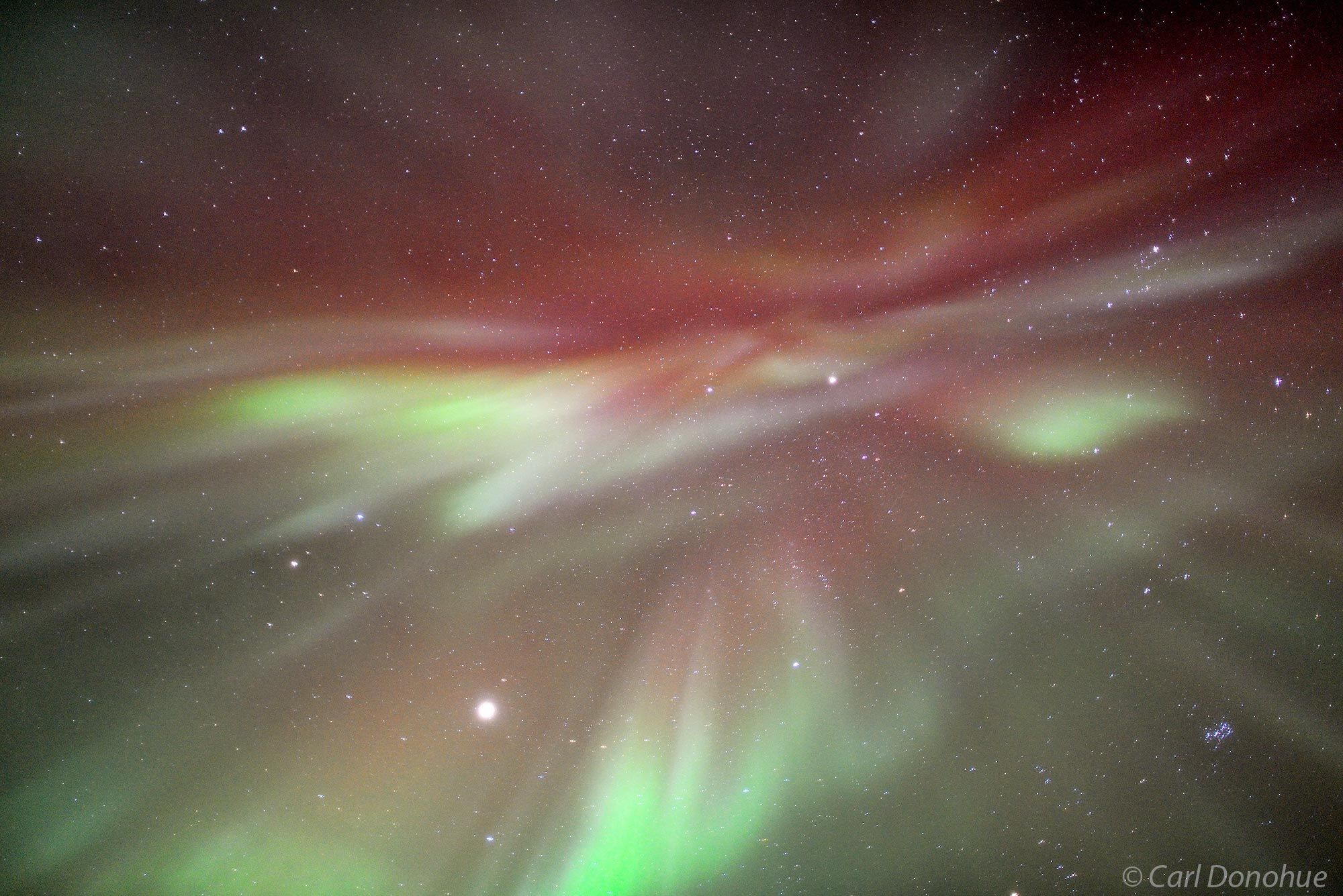 Looking directly overhead at the aurora's corona, or center of the aurora activity. A red corona isn't a common occurrence. Aurora...