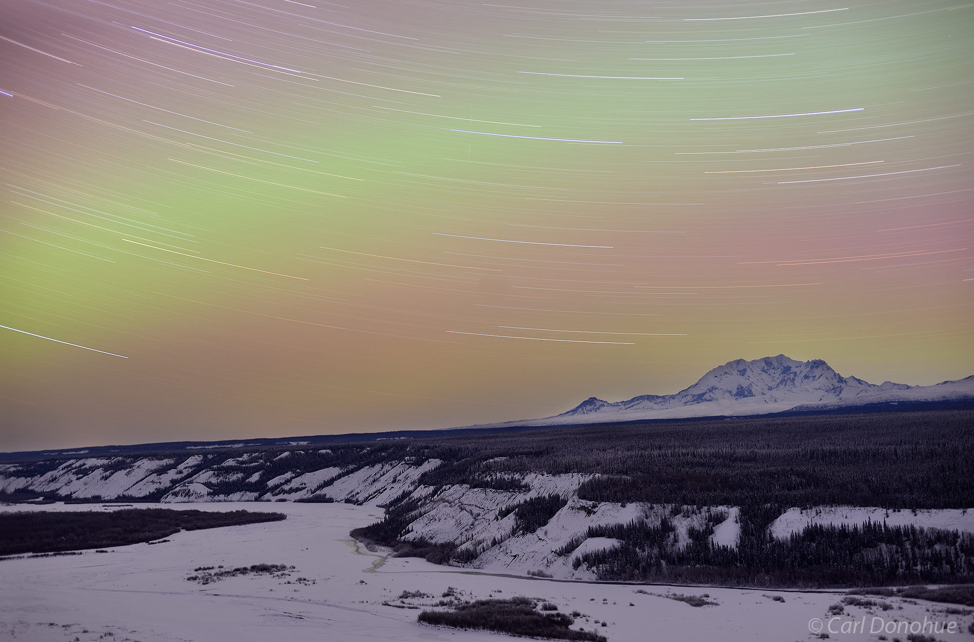 Aurora borealis photo, or northern lights, and star trails over Copper River, Mt. Drum, Wrangell - St. Elias National Park and...