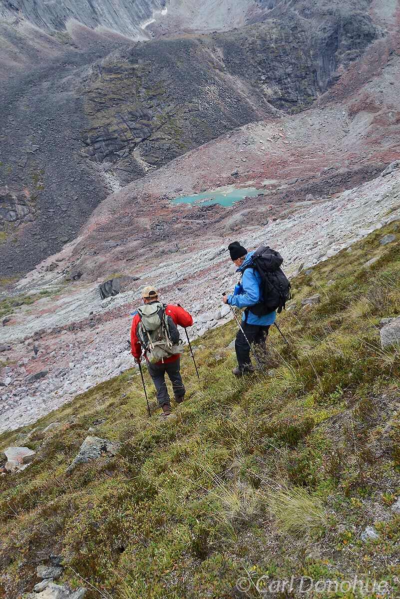 Backpackers descend to the valley floor in Arrigetch peaks, a popular backcountry destination in Gates of the Arctic National...