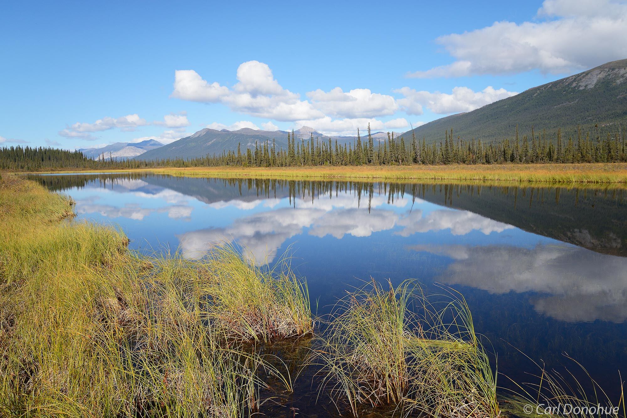 Circle Lake and reflections of the Brooks Mountains, Gates of the Arctic National Park and Preserve, Alaska.