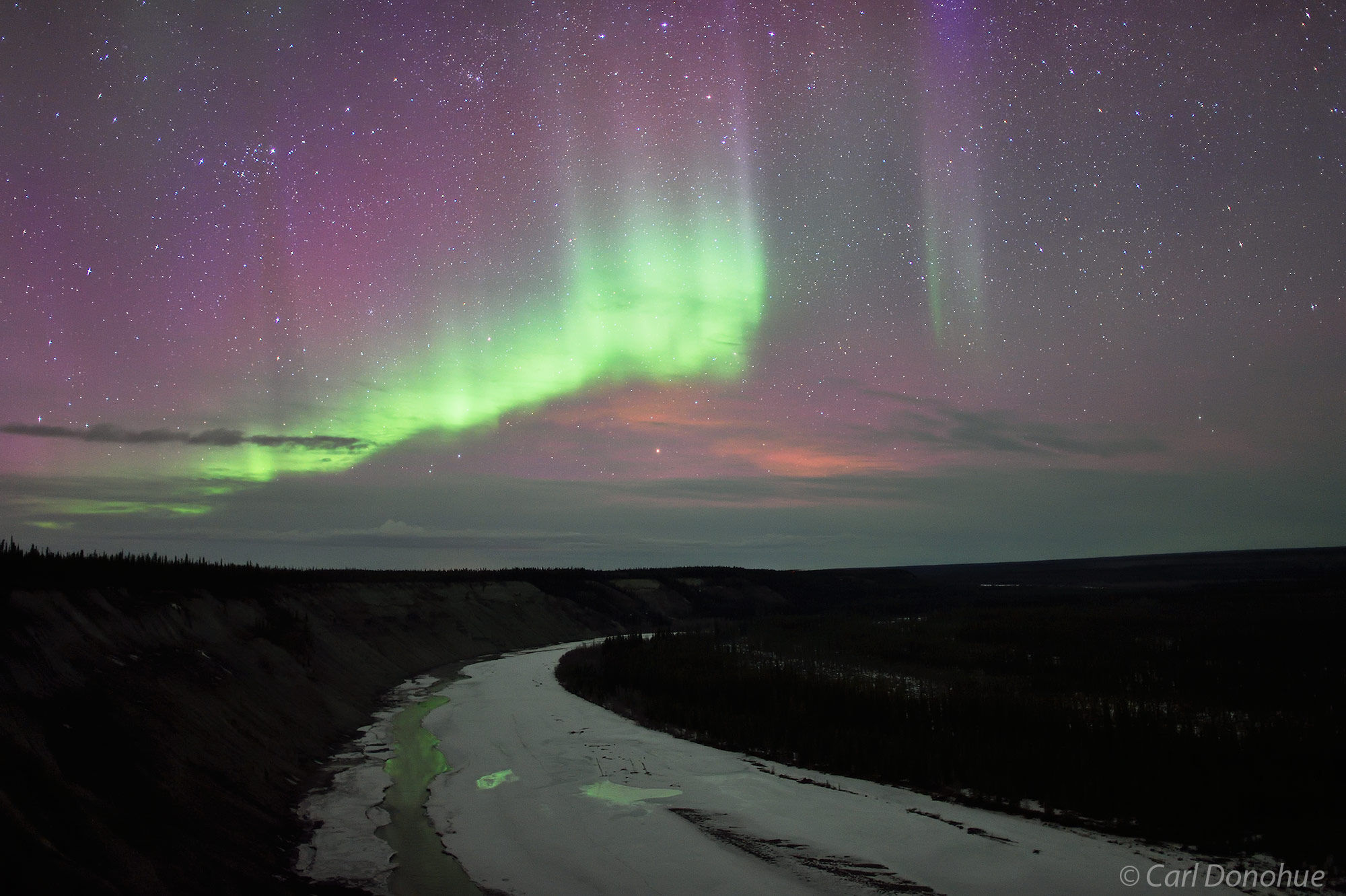 Northern Lights. A view of the Northern lights above a partially frozen Copper River near Wrangell - St. Elias National Park....