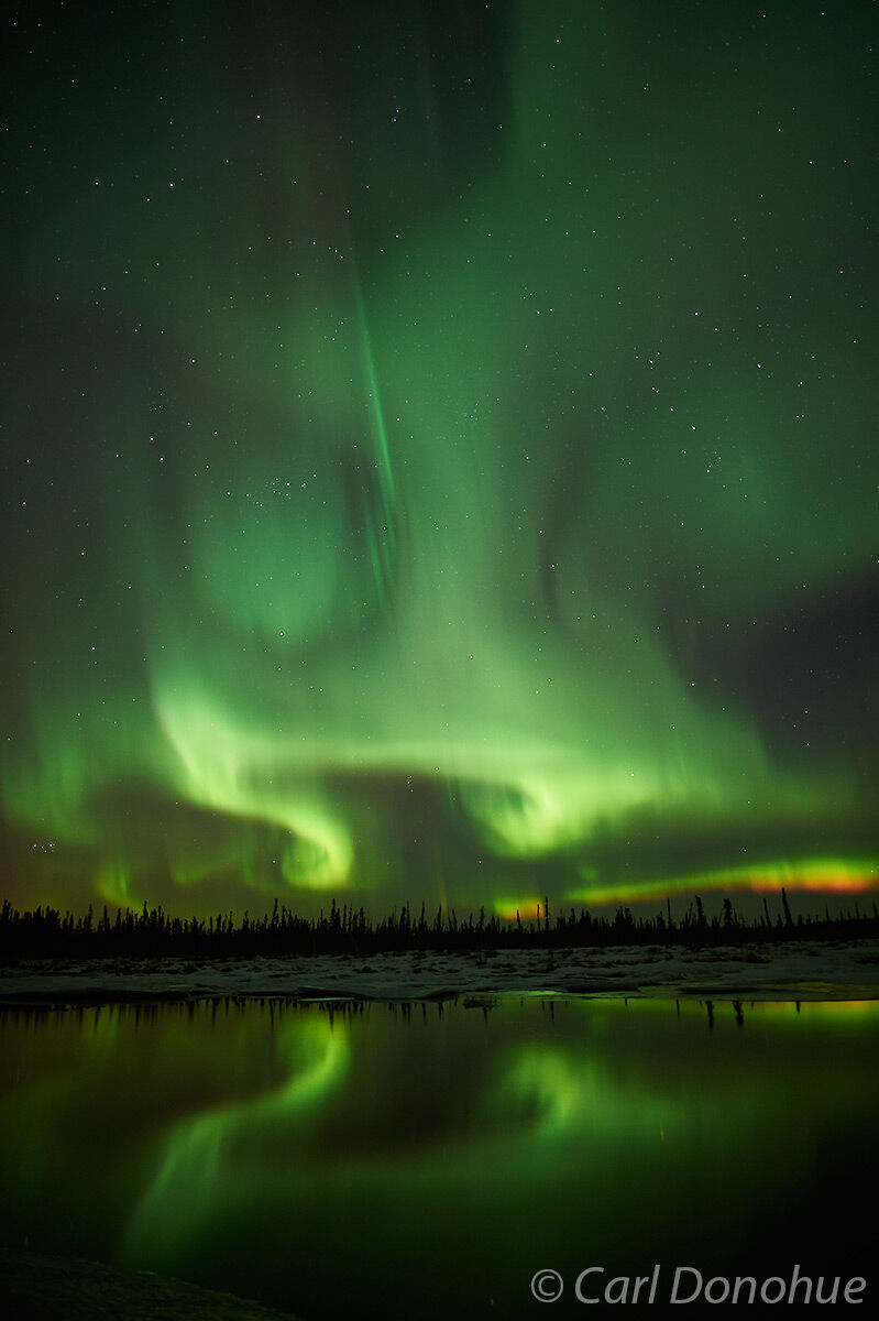 Aurora borealis with a nice reflection makes a nice photo, or northern lights, Alaska.
