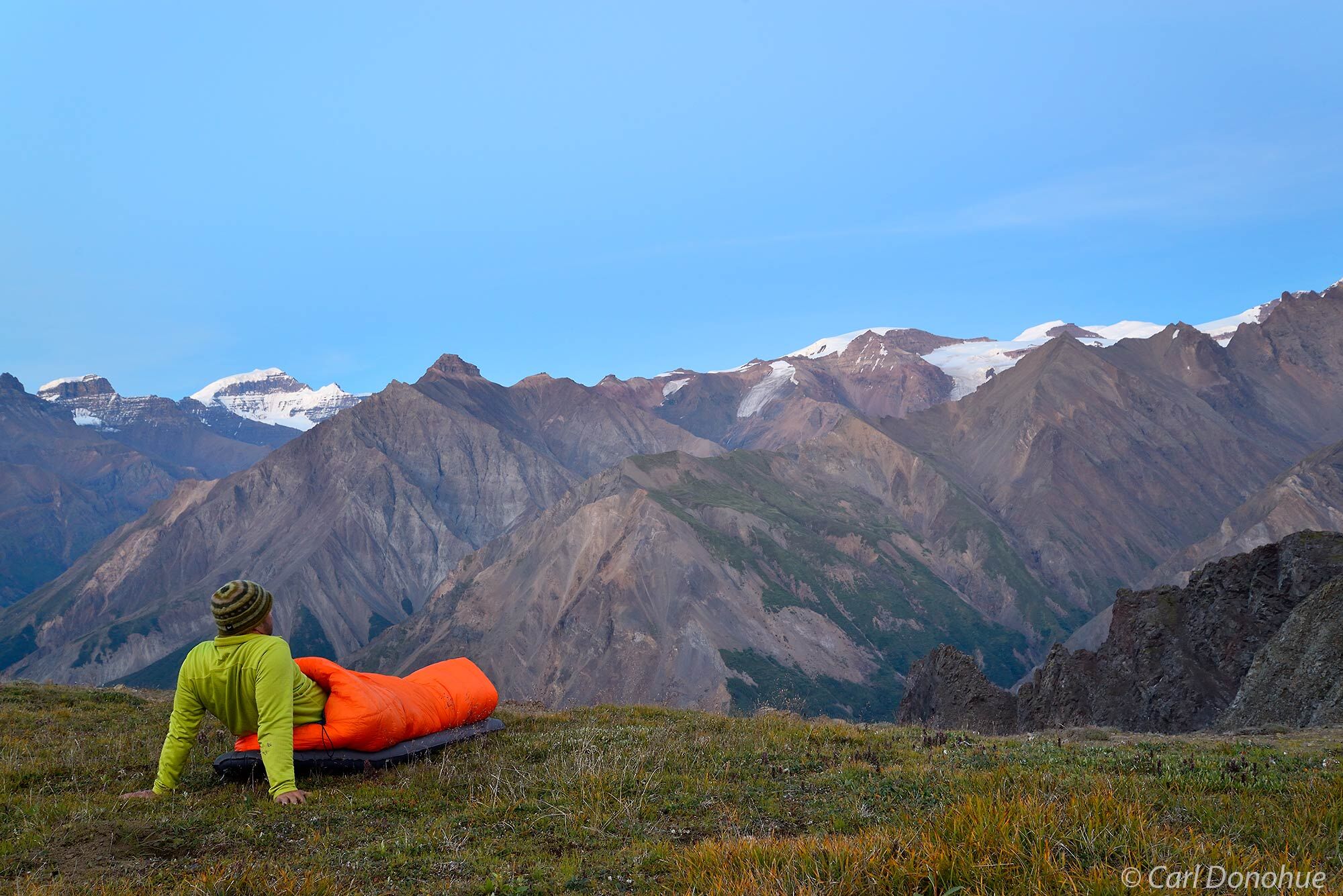 Sleeping outdoors with no tent on a backpacking trip, the Goat Trail, Chitistone Valley, Wrangell - St. Elias National Park...