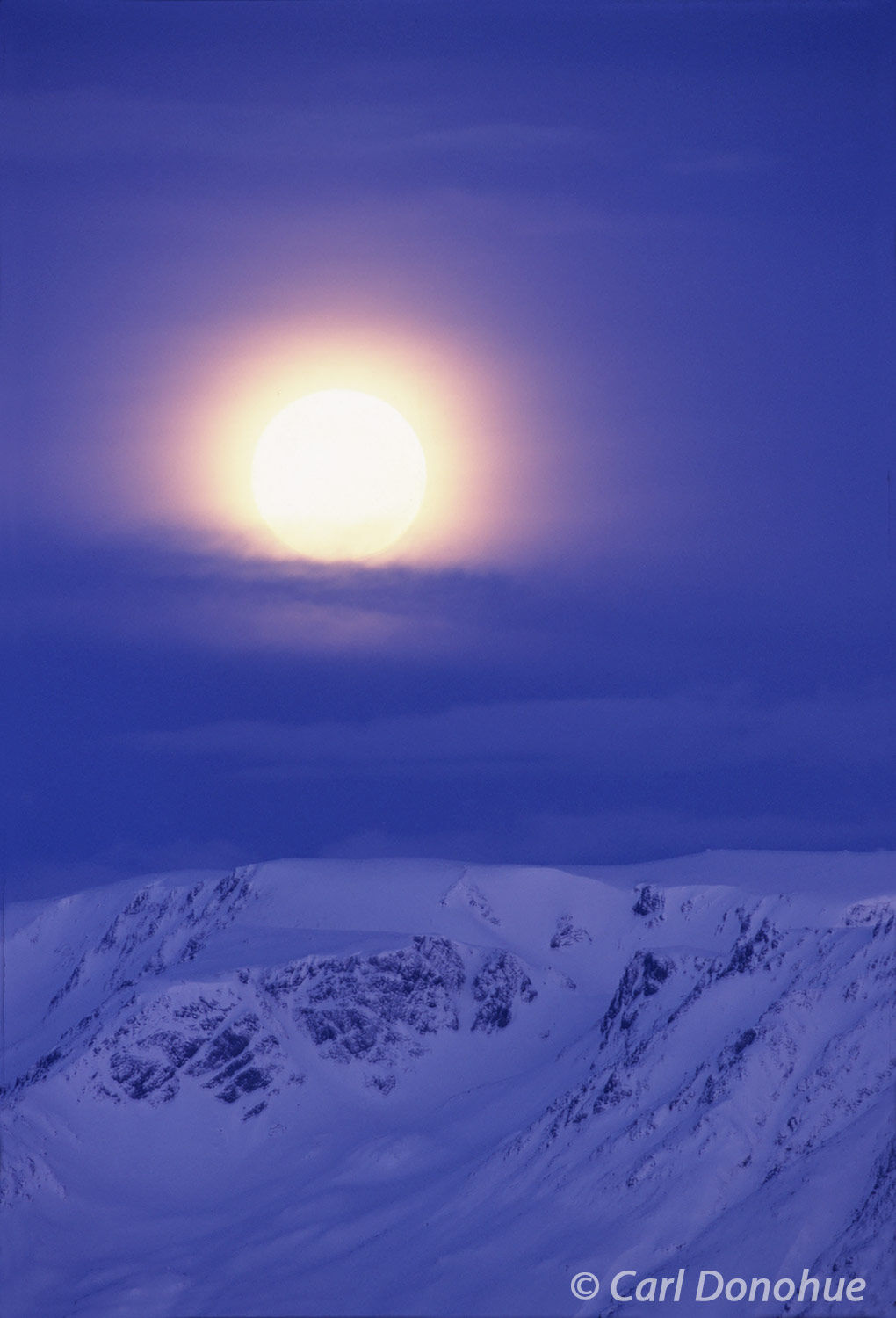 A glorious full moon! Near Homer, Alaska, in late winter, a gorgeous moonrise over Kachemak Bay, Homer, Alaska.