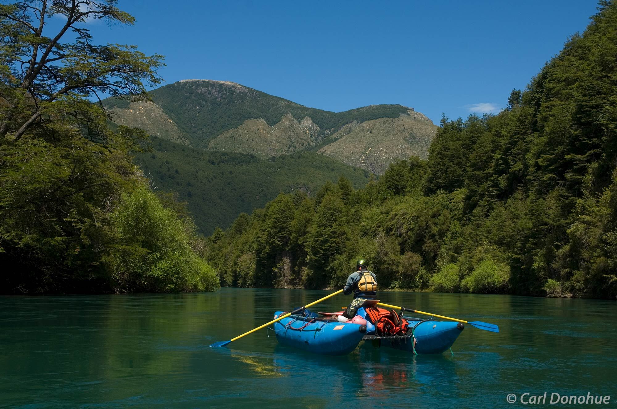 A safety Cataraft guide paddles down the Futaleufu River, Andes mountains, Region X, Patagonia, Chile. (model release available...