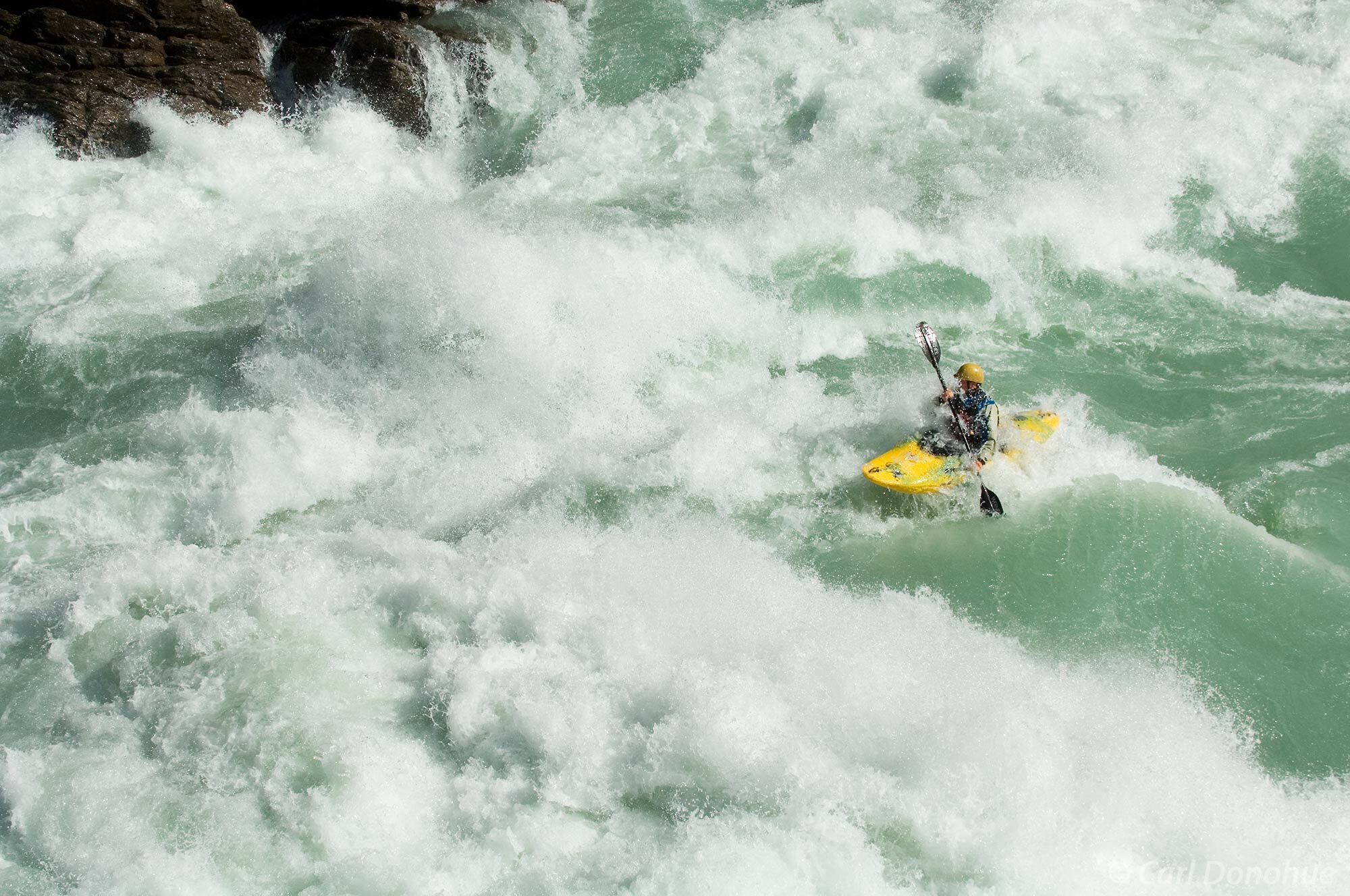 Whitewater kayaking on the Baker River. This huge river dwarfs a kayak in this narrow canyon. Whitewater kayaking, Baker River...