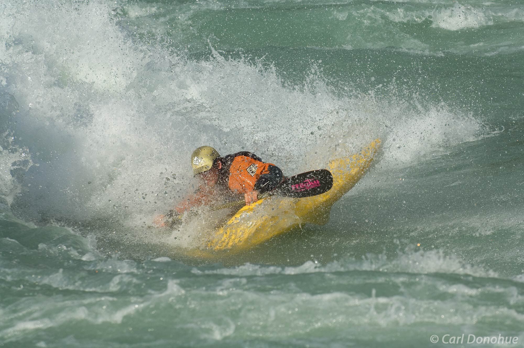 Whitewater kayaking on the Baker River. A standing wave provides Santiago Ibanez, a Peruvian kayaker, with endless opportunity...