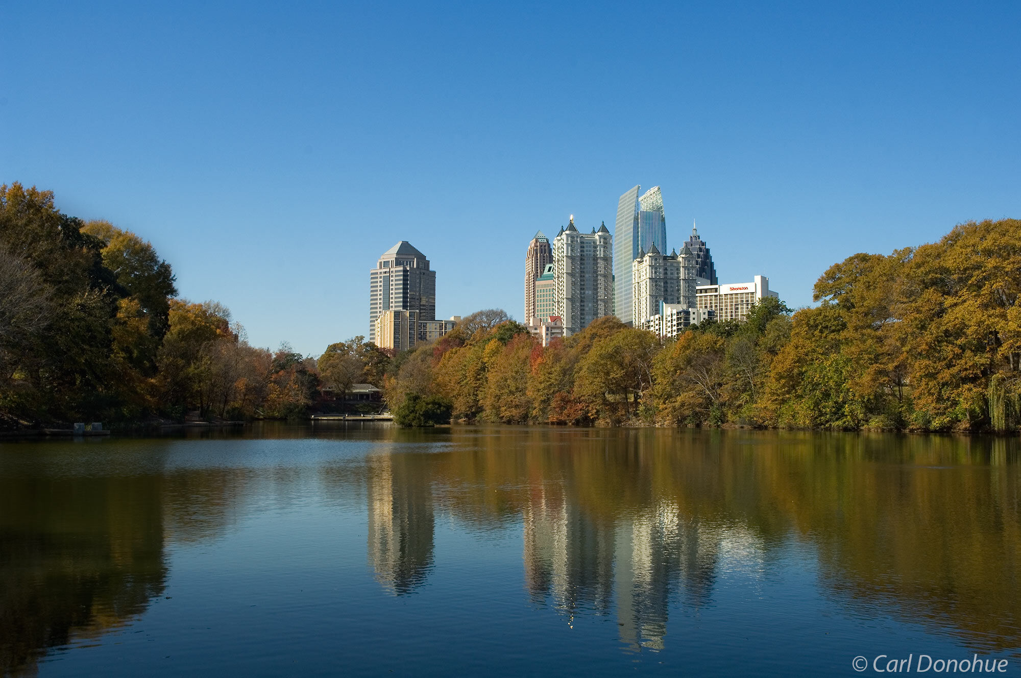Midtown Atlanta skyline, from Piedmont Park. The park and pond is a popular destination for tourists and resident sto relax and...