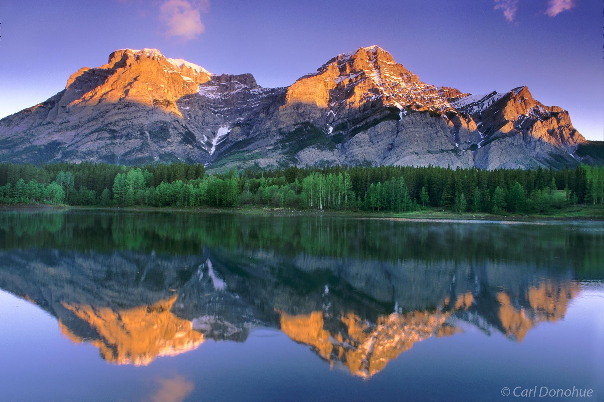 Reflections in Wedge Pond and dawn's alpen glow on Mt. Kidd, Upper Kananaskis Lakes, Day Use area, Kananaskis Country, Canadian...