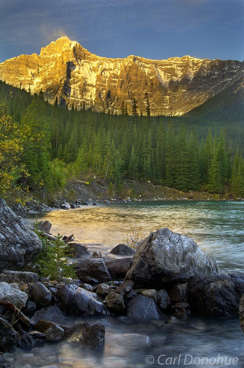 Reflections and dawn's alpenglow on mountain peaks, Upper Kananaskis Lakes, Day Use area, Kananaskis Country, Canadian Rockies...